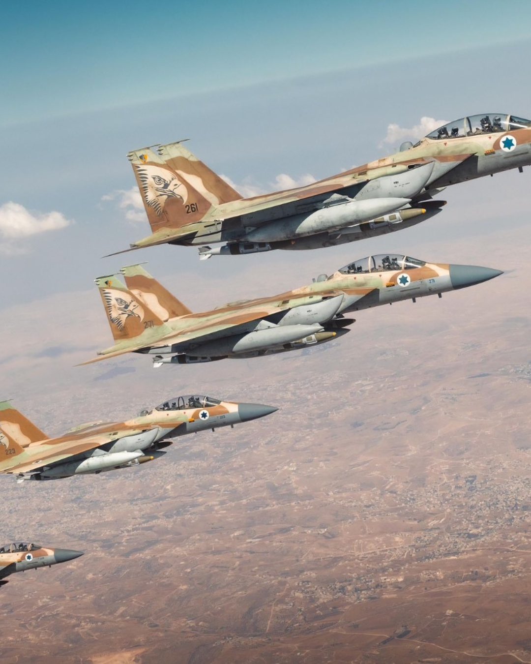 Formation of advanced fighter aircraft in flight, showcasing air superiority and modern defense capabilities.
