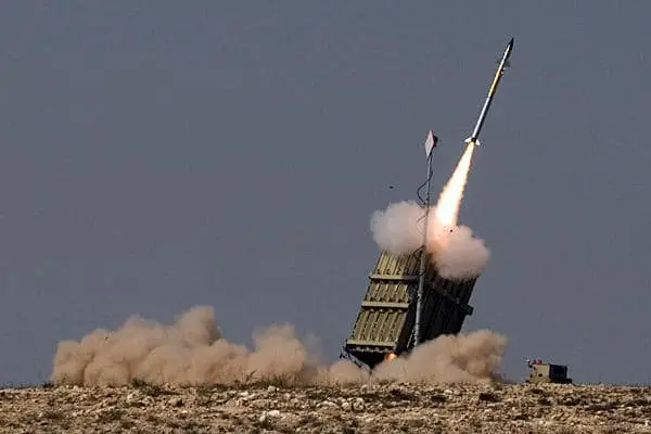 Iron Dome missile defense system launching an interceptor with B. Rimon energy systems ensuring operational readiness